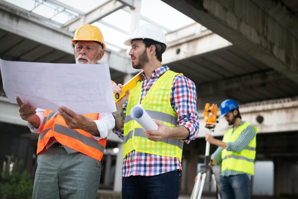 engineer foreman and worker discussing in building construction site.jpg